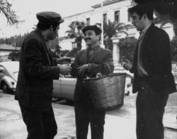 Nikos Tsoukas, accompanied by two fellow-villagers, gets ready to visit Maro (Nora Valsami), the woman that he loves, in Errikos Andreou's comedy Two feet in one shoe (Toe the line)